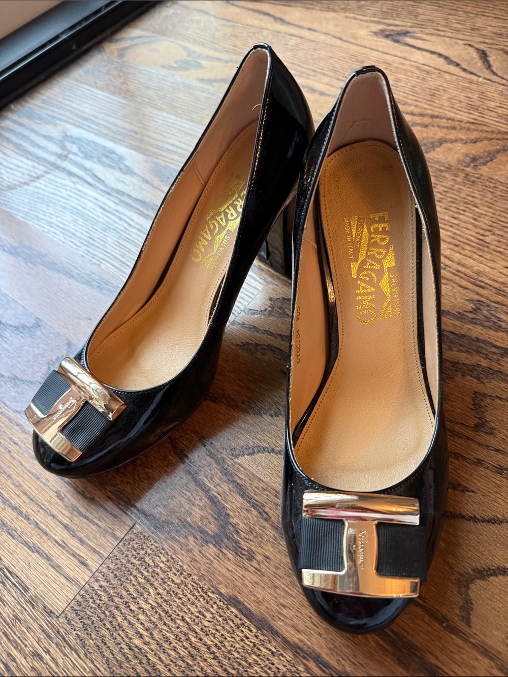 Salvatore Ferragamo Black Patent Pumps with Gold Vara Buckle
